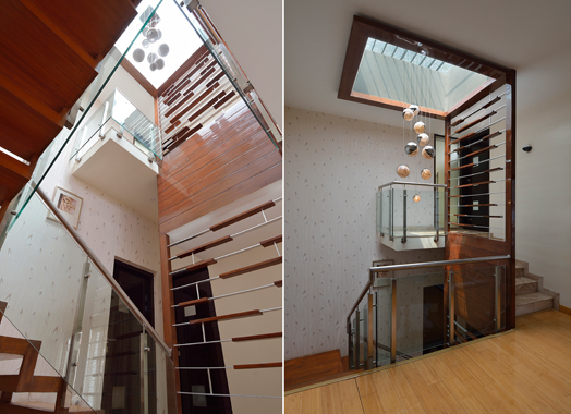 stairwell with skylight and decorative railing