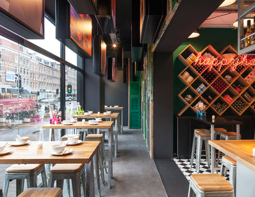glass facade gives a peek into the vibrant restaurant isnide