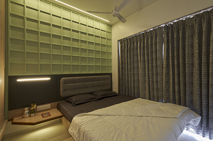 "bedroom with green backdrop Wardha apartment ClusterOneCreativeSolutions indiaartndesign"