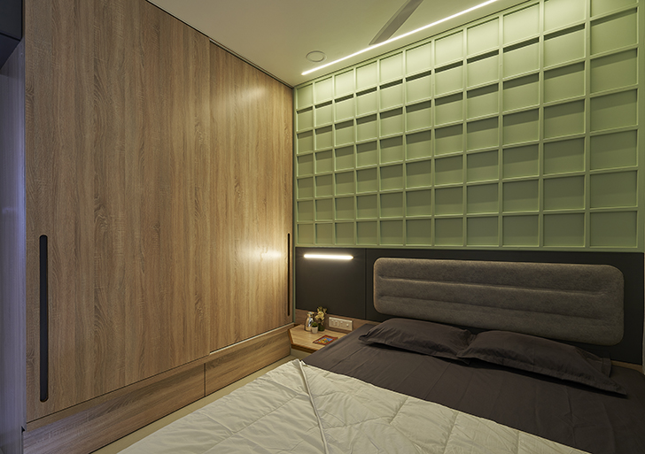 "bedroom with green backdrop Wardha apartment ClusterOneCreativeSolutions indiaartndesign"