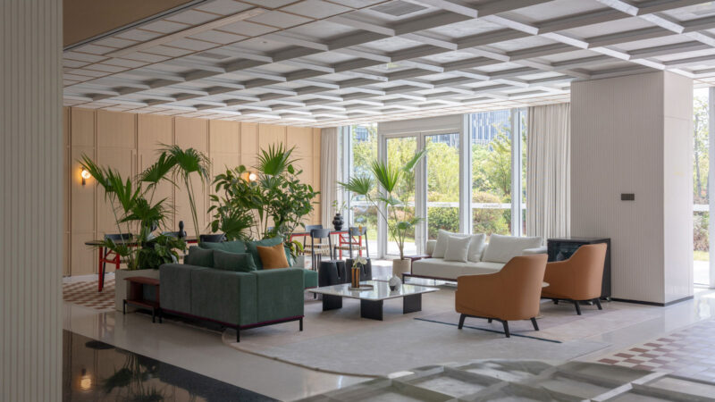 Interior views of Tengda HQ by Tales Creative featuring vibrant palettes, natural light, greenery & layered spatial design
