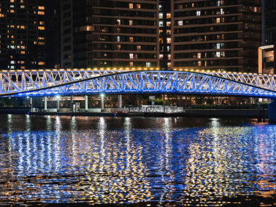 designed by hoshino architects and floating above tokyo's waterfront, Reimei Kobashi pedestrian bridge wins the architecture master prize infrastructure for 2025