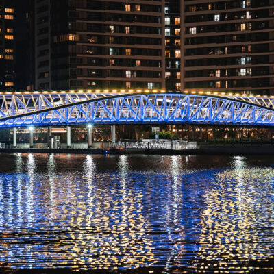 designed by hoshino architects and floating above tokyo's waterfront, Reimei Kobashi pedestrian bridge wins the architecture master prize infrastructure for 2025