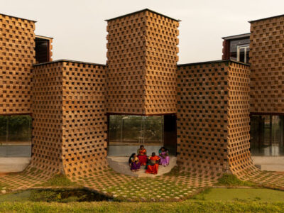 facade of petti restaurant made from earth-clad shipping containers designed by wallmakers