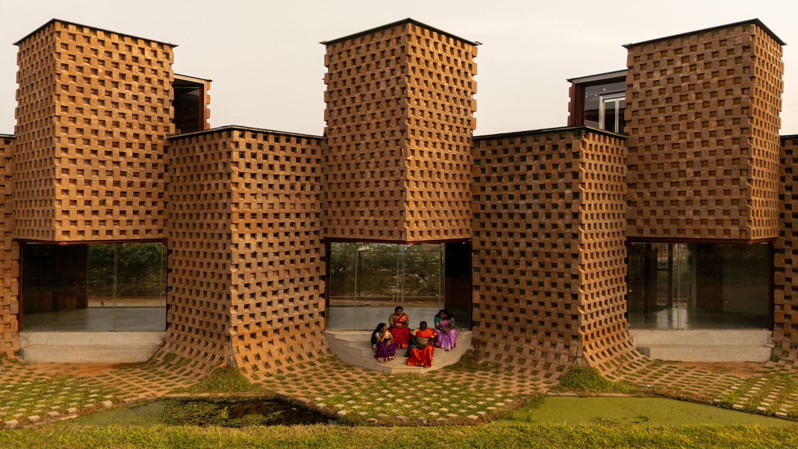 facade of petti restaurant made from earth-clad shipping containers designed by wallmakers