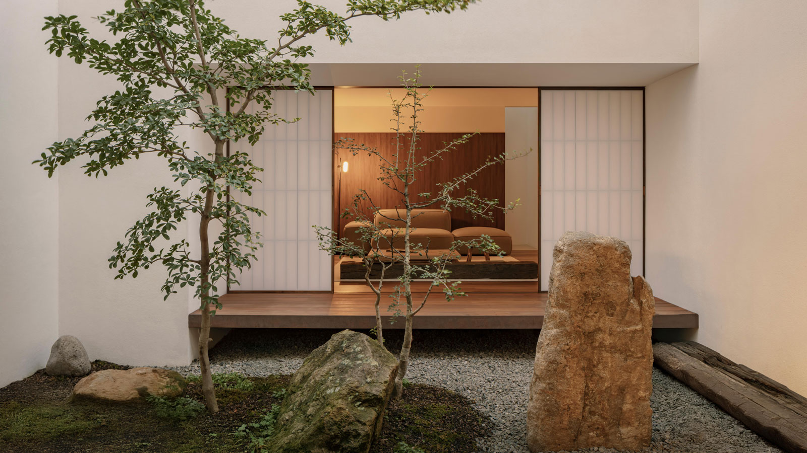 shoji screens orinet spaces around a central courtyard in the architect's own home in mexico designed by HW Studio