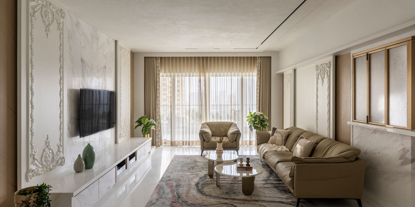 livingroom of luxurious four bedroom thane apartment designed by AND spaces