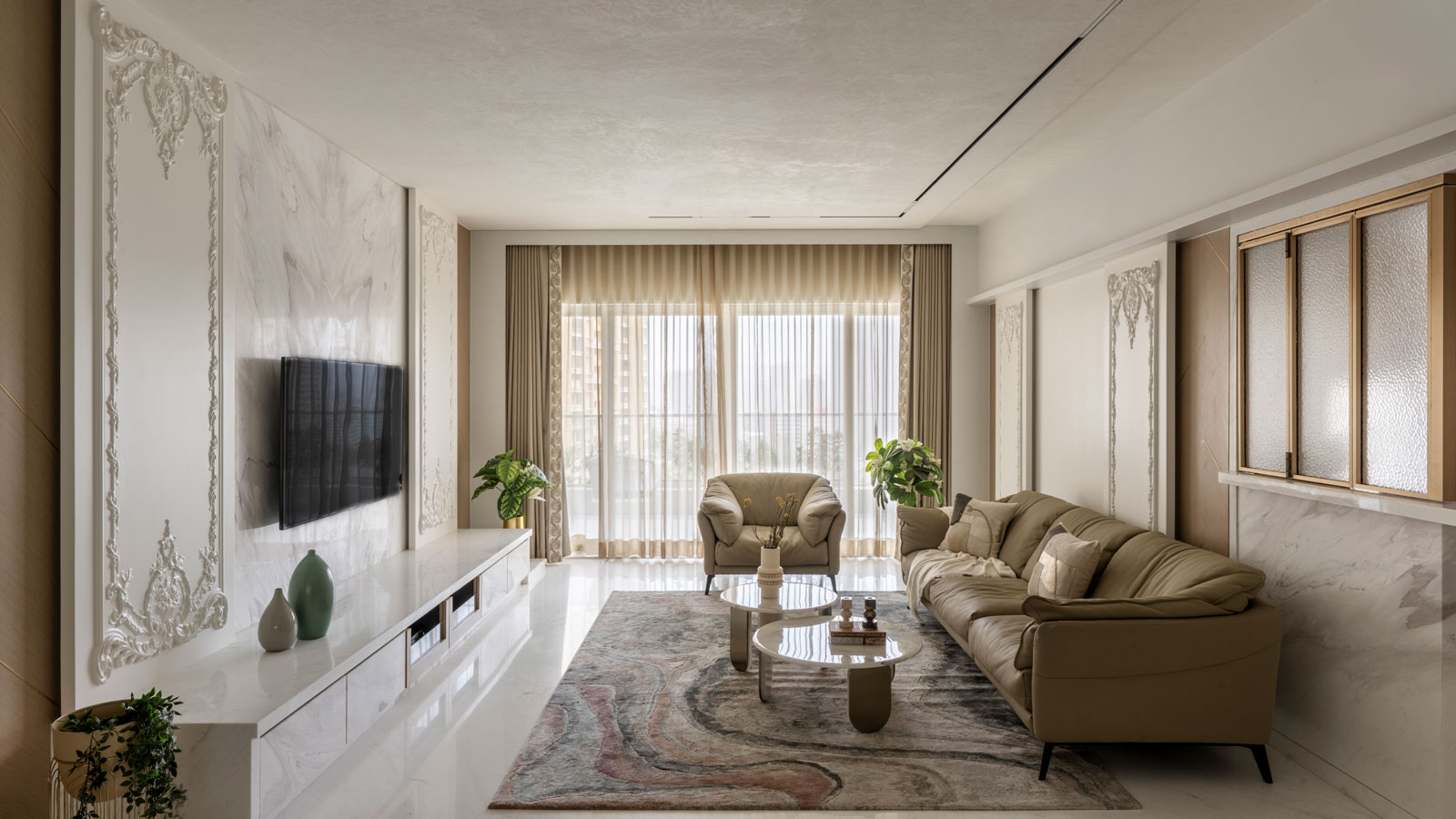 livingroom of luxurious four bedroom thane apartment designed by AND spaces