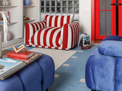Aktau apartment by SaBelle Design Group that builds its identity around a striking dialogue between red and blue.