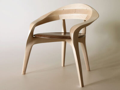 oruha is a sculptural chair designed by Yuya Nakazawa that shifts with light and perspective while remaining deeply comfortable